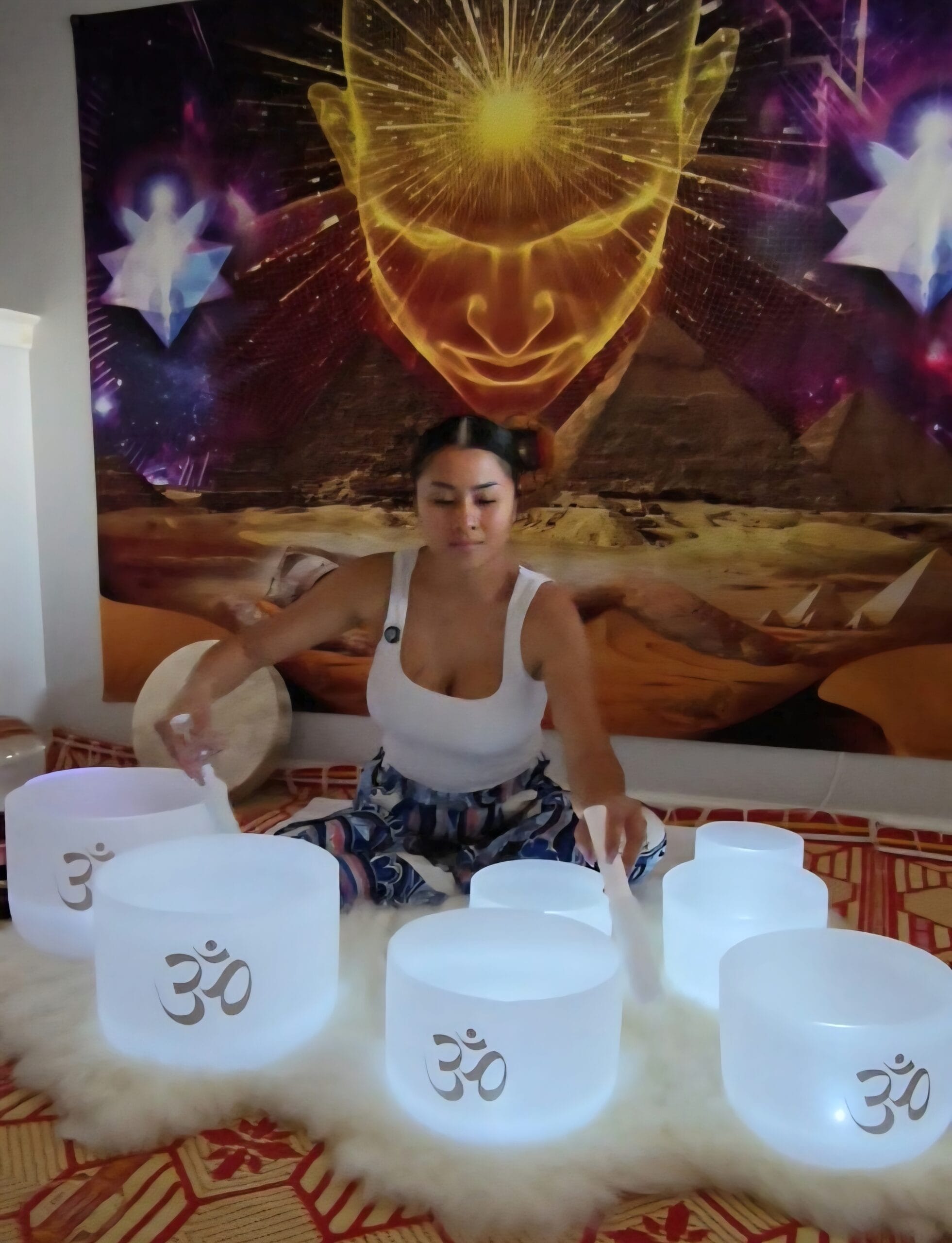 Sokpheak Doeung with her crystal singing bowls, prepared for a Cosmic Sound Healing session